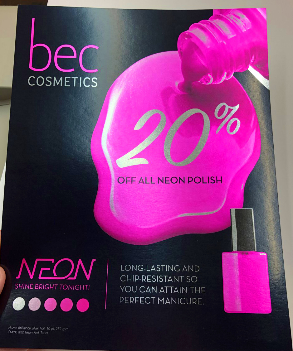 Hand-held cosmetics promotional print with bright pink artwork