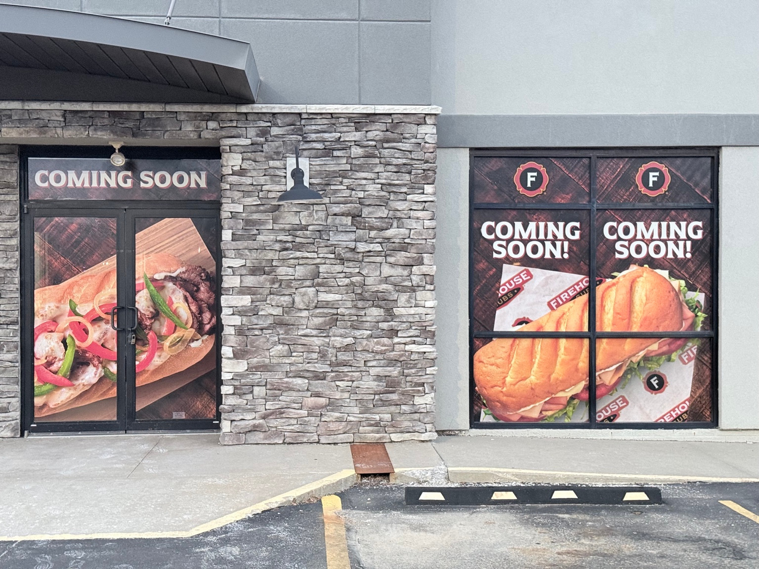 Installed storefront door and window graphics featuring sandwich photography.